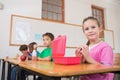 Cute pupils having their lunch in classroom