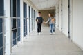 Cute pupils running down the hall at the elementary school Royalty Free Stock Photo