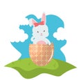 Cute rabbit with broken easter egg painted in the field Royalty Free Stock Photo