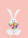 Cute rabbit with a bunch of Easter eggs. A hare with flowers.