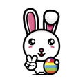 Cute rabbit cartoon character holding easter egg on easter day with peaceful finger Royalty Free Stock Photo