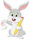 cute rabbit cartoon character with pencil and test paper Royalty Free Stock Photo