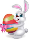 Cute rabbit cartoon holding easter egg