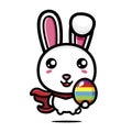 Cute rabbit hero cartoon character holding easter egg on easter day Royalty Free Stock Photo