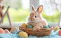 A cute rabbit rests in a basket filled with colorful eggs, symbolizing Easter joy and celebration. Royalty Free Stock Photo