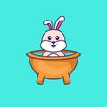 Cute rabbit taking a bath in the bathtub. Animal cartoon concept isolated. Can used for t-shirt, greeting card, invitation card or