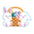 Cute rabbits couple with easter egg painted in basket Royalty Free Stock Photo