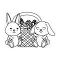 Cute rabbits couple with easter egg painted in basket Royalty Free Stock Photo