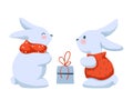 Cute Rabbits in Winter Outfit making Present