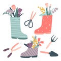 Cute rain boots with flowers and gardening tools set Royalty Free Stock Photo