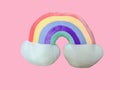 Cute rainbow pillow on isolated pink background Royalty Free Stock Photo