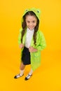 Cute raincoat kids would love. Frog style. Schoolgirl hooded raincoat enjoy fall weather. Rainproof accessories make Royalty Free Stock Photo