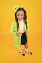 Cute raincoat kids would love. Frog style. Schoolgirl hooded raincoat enjoy fall weather. Rainproof accessories make Royalty Free Stock Photo