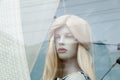 Cute realistic female blonde mannequin face close-up in a shop window. Royalty Free Stock Photo