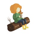 A cute red hair girl sits on the log and drinks hot chocolate.