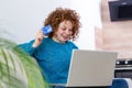 Cute red hair woman shopping online with credit card. woman holding credit card and using laptop. Online shopping concept Royalty Free Stock Photo