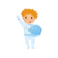 Cute red-haired teen boy wants to be cosmonaut in future. Cartoon child wearing astronaut costume and holding protective Royalty Free Stock Photo