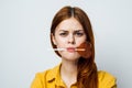 cute red-haired woman with lollipop in her mouth glamor closeup Royalty Free Stock Photo
