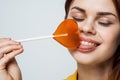 cute red-haired woman with lollipop in her mouth glamor closeup Royalty Free Stock Photo