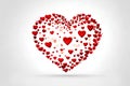 Cute red heart shape made with small red hearts on white background. Royalty Free Stock Photo