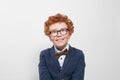 Cute redhead boy in glasses looking up on white background Royalty Free Stock Photo