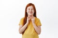 Cute redhead little girl, child making wish with fingers crossed, praying for something happen, dreaming, standing over Royalty Free Stock Photo