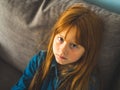 Cute redhead little girl looking at us serious Royalty Free Stock Photo