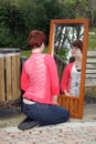 Cute Redhead Outdoors with a Mirror