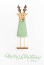 Cute reindeer chrismas decoration flat on white background. Xmas greeting card with reindeer toy.