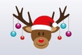 Cute reindeer with christmas tree balls and santa hat Royalty Free Stock Photo