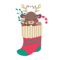 Cute reindeer and goodies in Christmas stocking