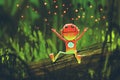 Cute robot playing with fireflies in forest at night Royalty Free Stock Photo