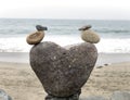 Cute rock art statue of two ducks at the beach