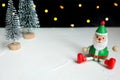 Cute Santa claus doll and Christmas tree on bokeh lights background. Royalty Free Stock Photo