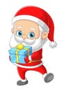 The cute santa claus is giving the gift box to the children in the christmas day Royalty Free Stock Photo