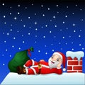 Cute santa claus on the house roof chimney with bag of gifts Royalty Free Stock Photo