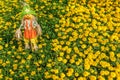 Cute scarecrow in colorful flower garden. Nature background Royalty Free Stock Photo
