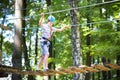 Cute school boy in a climbing activity park Royalty Free Stock Photo