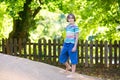 Cute school boy on playground on hot sunny day Royalty Free Stock Photo