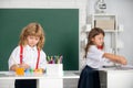 Cute school friends kids drawing and painting at school. Friendly boy an girl funny pupils draw. Friendship in school Royalty Free Stock Photo