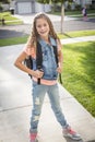 Cute school girl heading off to school in the morning Royalty Free Stock Photo