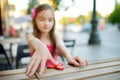 Cute school girl playing with colorful fidget spinner Royalty Free Stock Photo