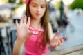 Cute school girl playing with colorful fidget spinner Royalty Free Stock Photo