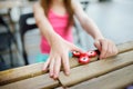 Cute school girl playing with colorful fidget spinner Royalty Free Stock Photo