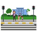 cute school kids with backpacks waiting for stop sign at pedestrian traffic light to cross at pedestrian crossing on their way to Royalty Free Stock Photo