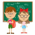 Cute school kids with glasses standing near blackboard. Back to school concept