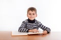 Cute schoolboy is reading a book Royalty Free Stock Photo