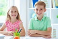 Schoolchildren are came back to school and learning at the table Royalty Free Stock Photo