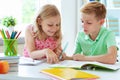 Schoolchildren are came back to school and learning at the table Royalty Free Stock Photo