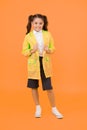 Cute schoolgirl feel protected. Happy schoolgirl wear raincoat. Invest in durable kids rainwear to keep children out in